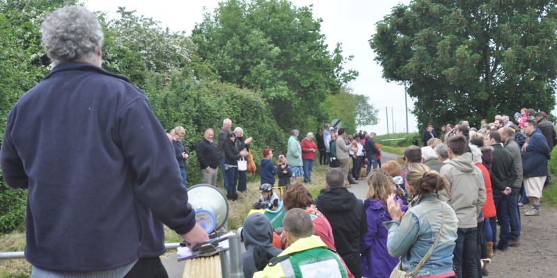 Spectators at allotment corner
